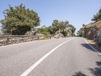 a car driving down the middle of a road with no cars on it's way