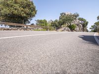 a car driving down the middle of a road with no cars on it's way