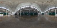 an empty room with arched ceiling, white walls and brown floors is shown on a 360 - angle view