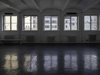 a room that is empty with a window on the side and the ceiling of the room behind it