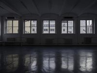 a room that is empty with a window on the side and the ceiling of the room behind it