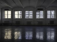 a room that is empty with a window on the side and the ceiling of the room behind it