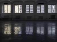 a room that is empty with a window on the side and the ceiling of the room behind it