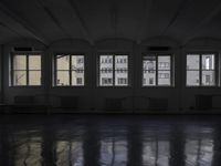 a room that is empty with a window on the side and the ceiling of the room behind it