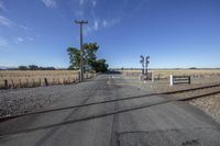 an empty road is shown in this photograph with tracks running along it and a street sign at the end