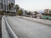 an empty sidewalk with signs along side of it in the city of los angeles, california