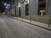 the sidewalk is empty of any vehicles, and the storefronts are glassed