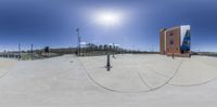 this is an empty skate park with the sun shining brightly behind it, on the ground