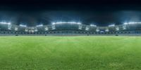 a large green baseball field with lights shining on it's sides in an empty stadium