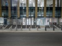 a street lined with multiple sets of benches in front of a building that says the station is empty