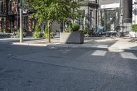 an empty street is full of apartment buildings on a sunny day in toronto, ontario