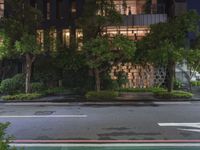 an empty street has been blocked off from traffic with a caution tape, at night