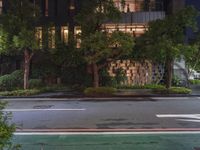 an empty street has been blocked off from traffic with a caution tape, at night