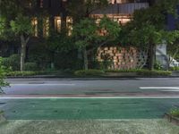 an empty street has been blocked off from traffic with a caution tape, at night