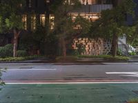 an empty street has been blocked off from traffic with a caution tape, at night