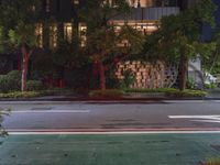 an empty street has been blocked off from traffic with a caution tape, at night