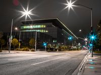 the street is empty as a street light shines brightly against the night sky outside the building