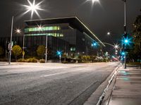 the street is empty as a street light shines brightly against the night sky outside the building