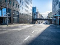 an empty street is pictured at a busy intersection in the city of london, england