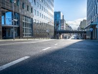 an empty street is pictured at a busy intersection in the city of london, england