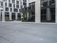 an empty street near buildings in the city of london, england, with no cars