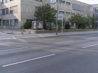 the corner of a street is empty and no cars are present in the road at this time