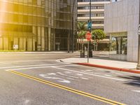 the view from the corner at the intersection of an empty street with a traffic signal