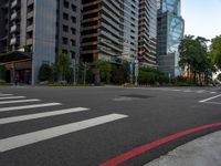 this is an image of an empty street corner that shows cars and people on it