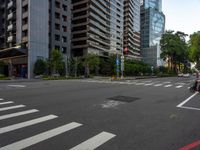 this is an image of an empty street corner that shows cars and people on it