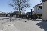 the street corner is empty and it shows signs for cars to stop at the entrance