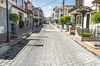 a street with some buildings that are empty and one bench is in the middle of it