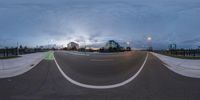 a fisheye lens image of an empty street at dusk in the city of toronto, ontario