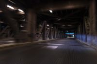 an empty street and a highway with a truck on it at night time with motion blur