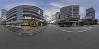 an image of an empty street taken from the fisheye lens showing the intersection of streets and cars