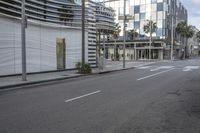 the empty street in front of a building is empty and empty from cars or people