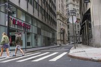 an empty city street with two tall buildings and a sign that reads nemo delect