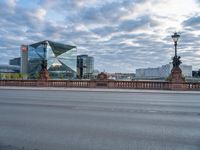 the street is empty next to the building near the water tower in berlin, germany