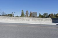 the city is empty and there are no people in it for a picture, this is in front of some cement