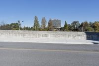 the city is empty and there are no people in it for a picture, this is in front of some cement