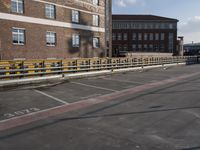 a street with no cars on it and two parking spaces on the side of it