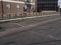a street with no cars on it and two parking spaces on the side of it