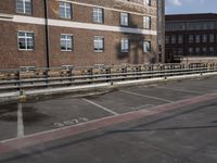 a street with no cars on it and two parking spaces on the side of it
