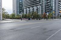 empty street with skyscrapers in the background and empty roads ahead on both sides of the picture