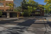 a stop sign on an empty street with no cars parked in front of it,