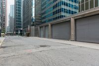 an empty street is seen in this photo taken from the outside of buildings and with no people