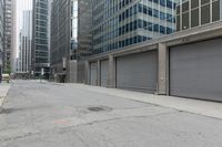 an empty street is seen in this photo taken from the outside of buildings and with no people