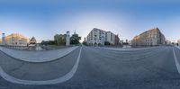 three different shots of an empty street, with buildings in the background and a man on a skateboard