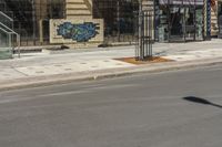 the street is empty, and empty of vehicles parked on the sidewalks at the intersection