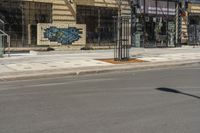 the street is empty, and empty of vehicles parked on the sidewalks at the intersection