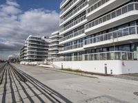 the walkway to the beach from the building looks empty, and it's long